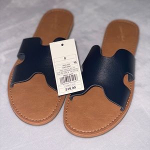 Tan and black sandals